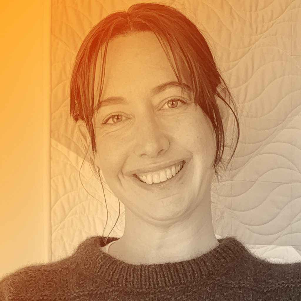 A white female with very dark brown hair hazel eyes. Tall with medium build.